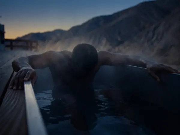 An athlete soaking at dusk